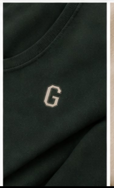 Embroidered varsity G on dark green fabric